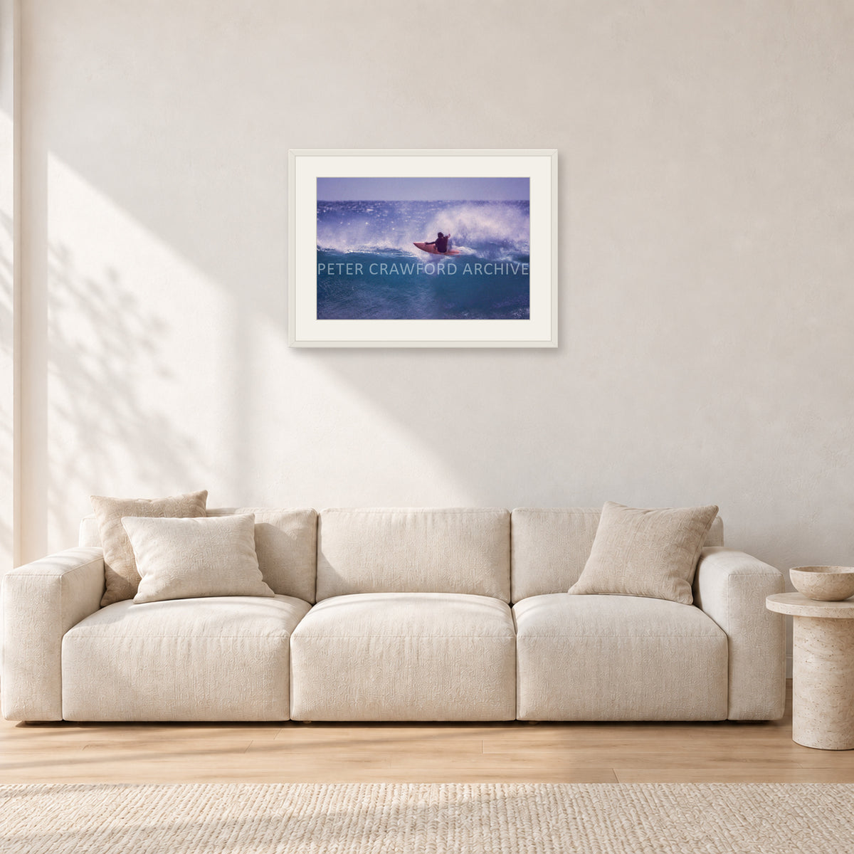 Bruce Raymond, Stubbies 1980 by Peter Crawford — 60 × 40 cm, white frame with white mat, shown in a light minimalist living room.