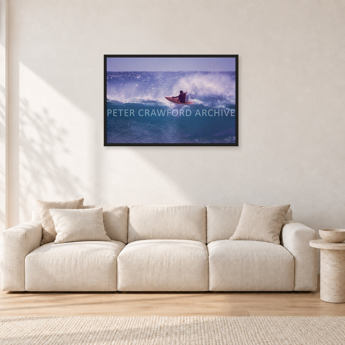 Bruce Raymond, Stubbies 1980 by Peter Crawford — 90 × 60 cm, black frame, shown in a light minimalist living room.