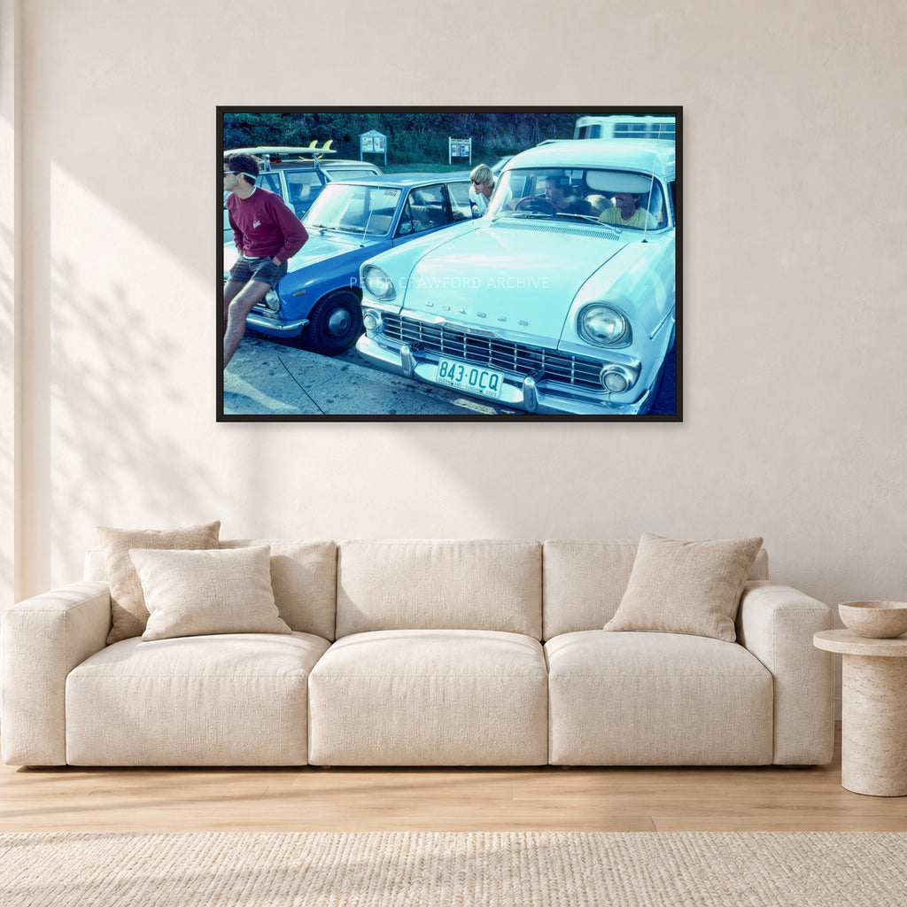 Bugs, Rainbow Bay 1976 by Peter Crawford — 120 × 80 cm, black frame, shown in a light minimalist living room.