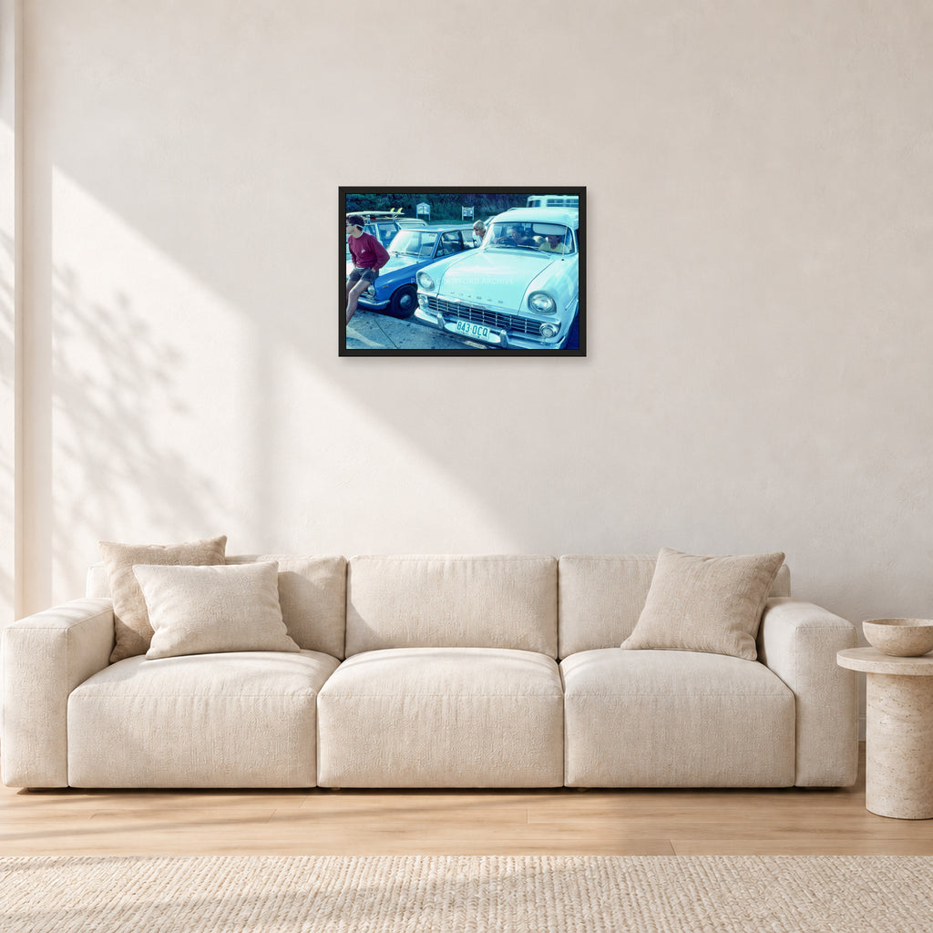 Bugs, Rainbow Bay 1976 by Peter Crawford — 60 × 40 cm, black frame, shown in a light minimalist living room.
