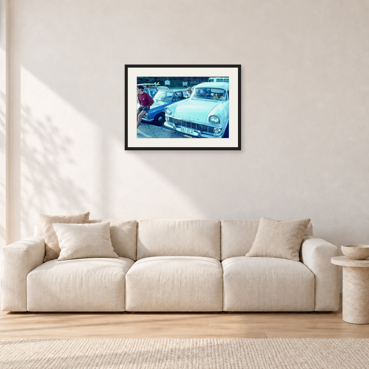 Bugs, Rainbow Bay 1976 by Peter Crawford — 60 × 40 cm, black frame with white mat, shown in a light minimalist living room.