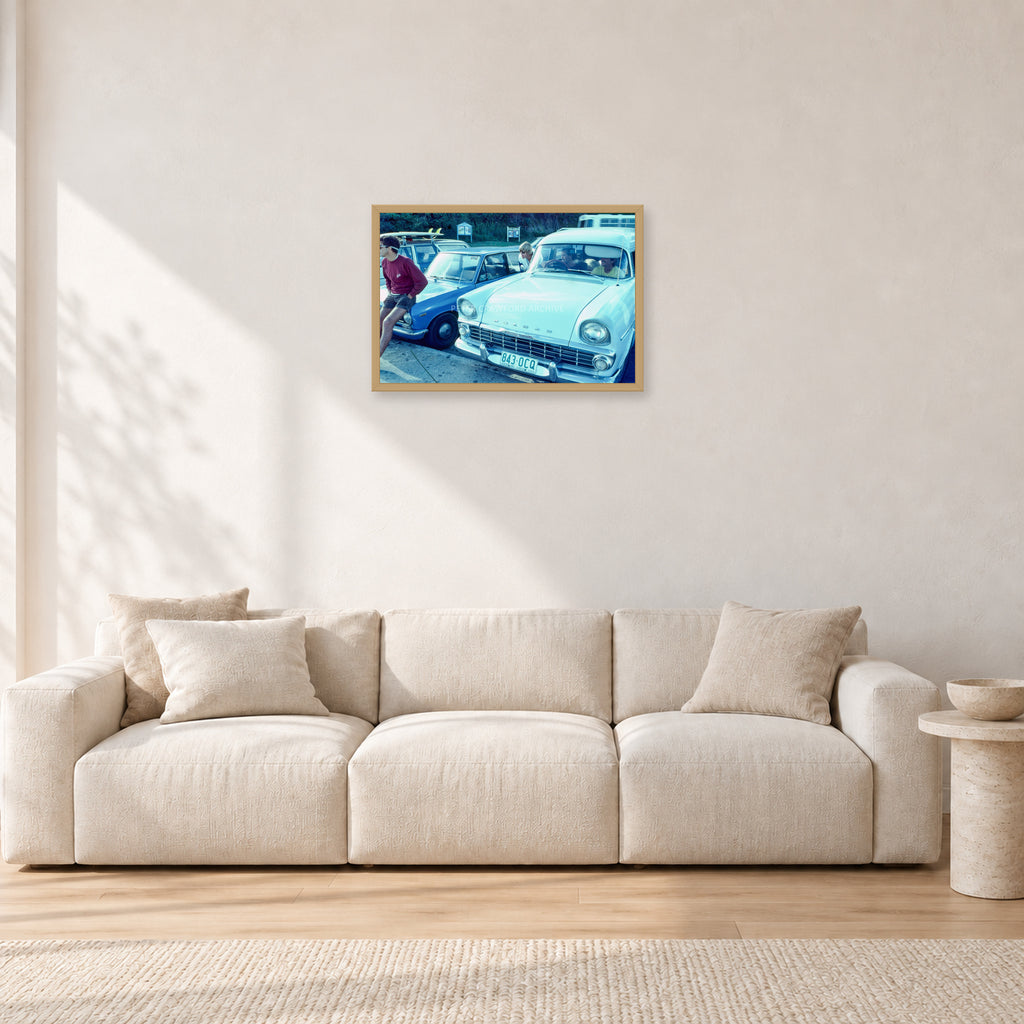 Bugs, Rainbow Bay 1976 by Peter Crawford — 60 × 40 cm, hayseed frame, shown in a light minimalist living room.