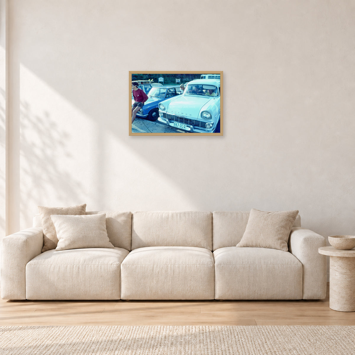 Bugs, Rainbow Bay 1976 by Peter Crawford — 60 × 40 cm, hayseed frame, shown in a light minimalist living room.