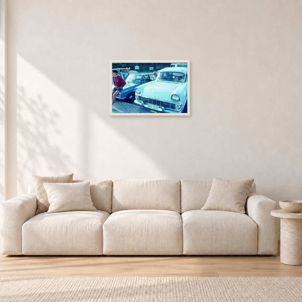 Bugs, Rainbow Bay 1976 by Peter Crawford — 60 × 40 cm, white frame, shown in a light minimalist living room.