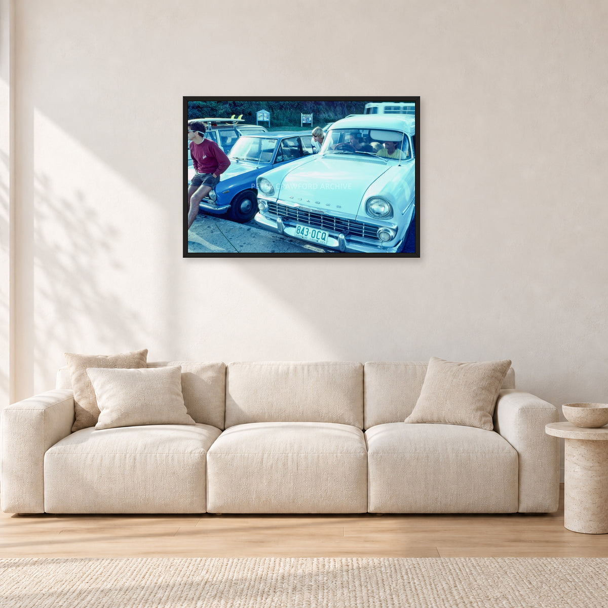 Bugs, Rainbow Bay 1976 by Peter Crawford — 90 × 60 cm, black frame, shown in a light minimalist living room.