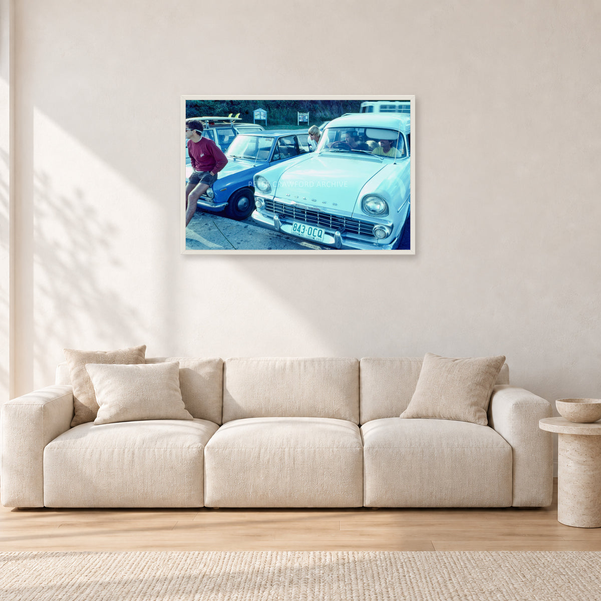 Bugs, Rainbow Bay 1976 by Peter Crawford — 90 × 60 cm, white frame, shown in a light minimalist living room.