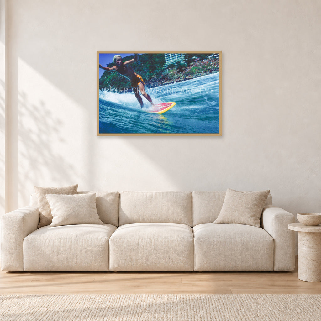 Cheyne Horan, Stubbies 1978 by Peter Crawford — 90 × 60 cm, hayseed frame, shown in a light minimalist living room.