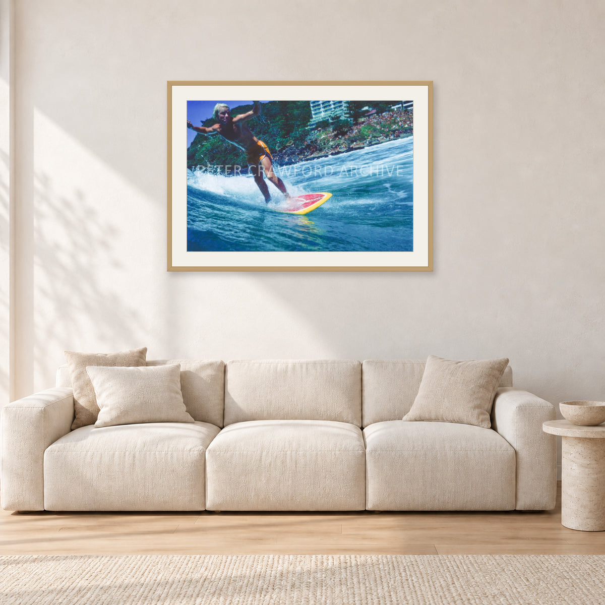 Cheyne Horan, Stubbies 1978 by Peter Crawford — 90 × 60 cm, hayseed frame with white mat, shown in a light minimalist living room.
