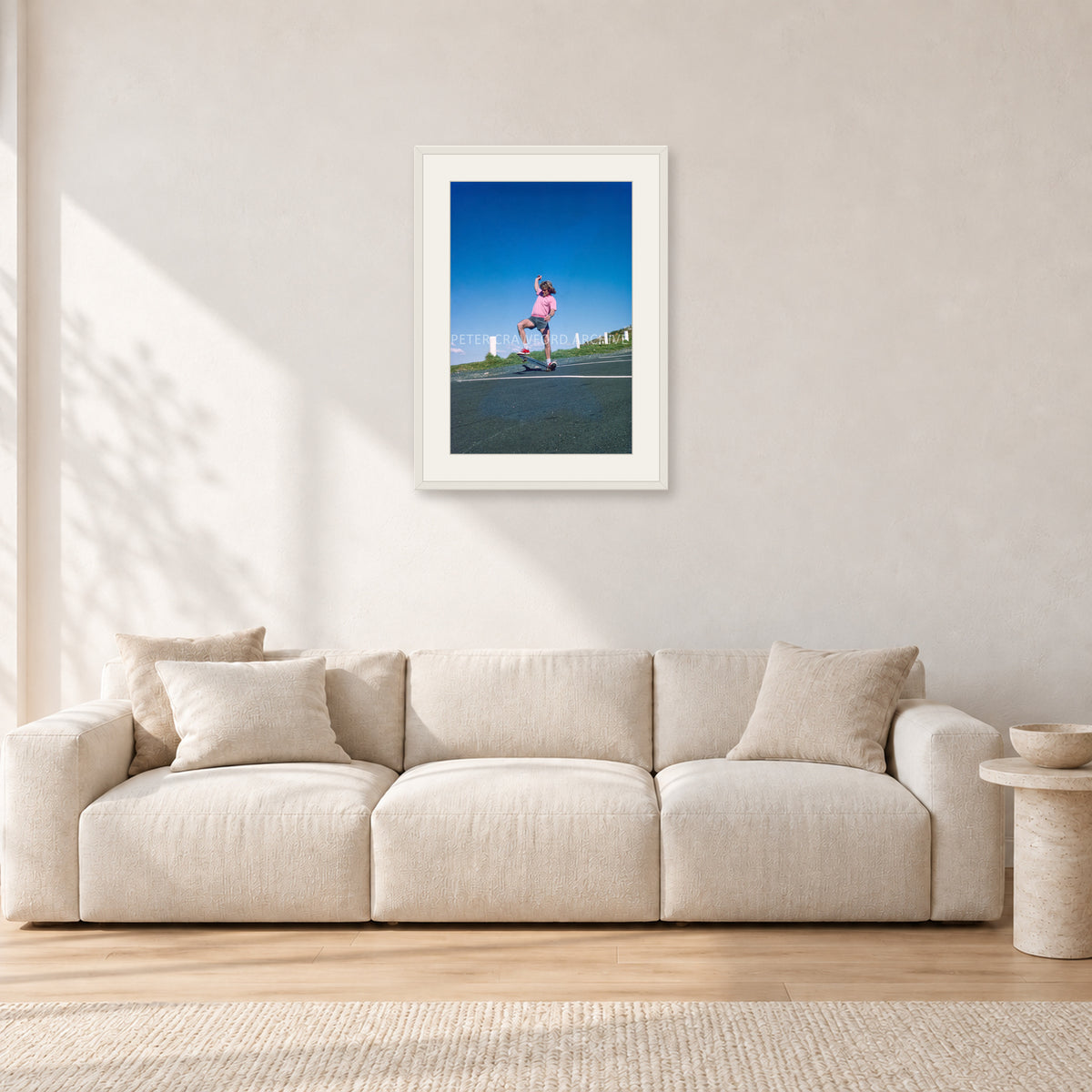 Col Smith DY 1977 by Peter Crawford — 40 × 60 cm, white frame with white mat, shown in a light minimalist living room.