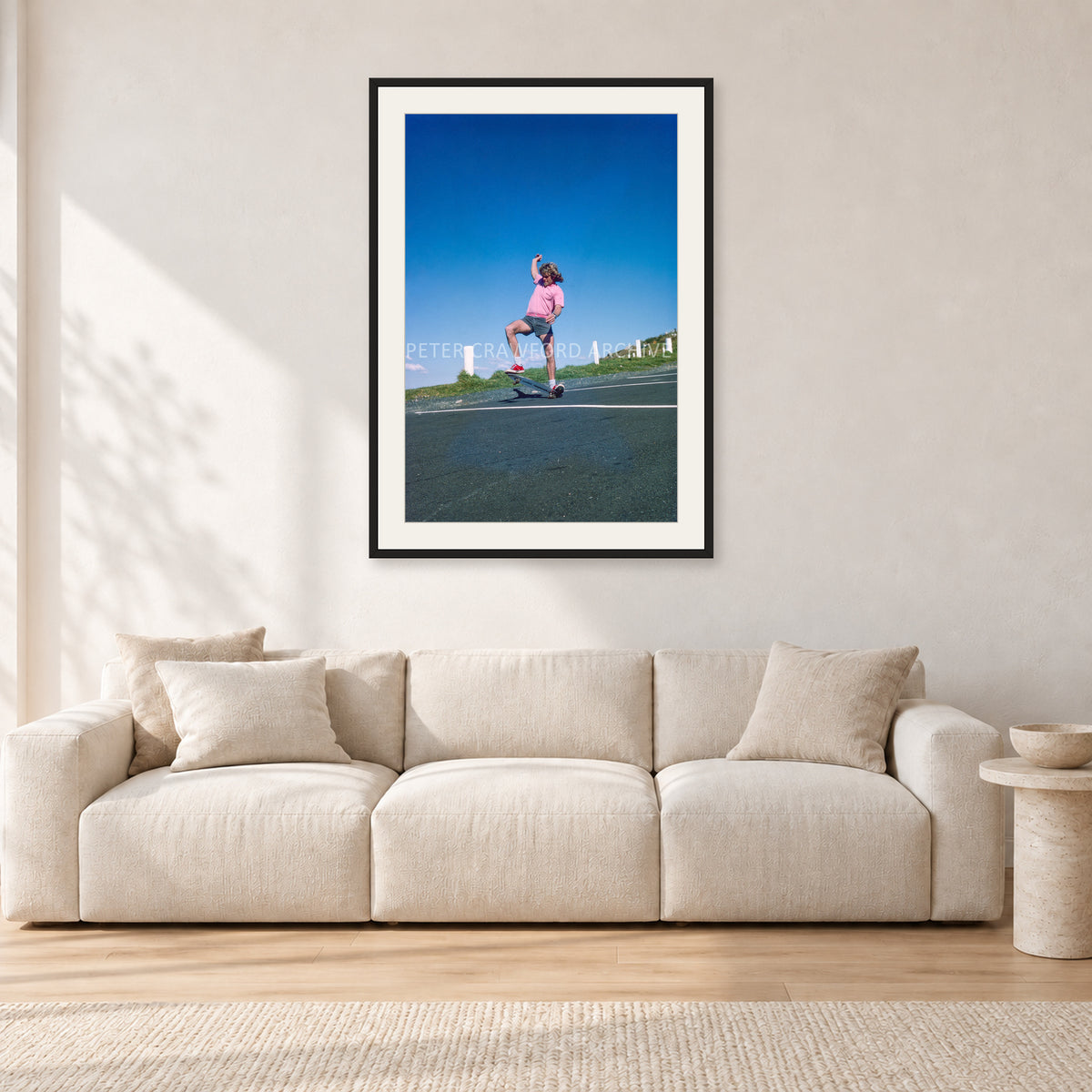Col Smith DY 1977 by Peter Crawford — 60 × 90 cm, black frame with white mat, shown in a light minimalist living room.