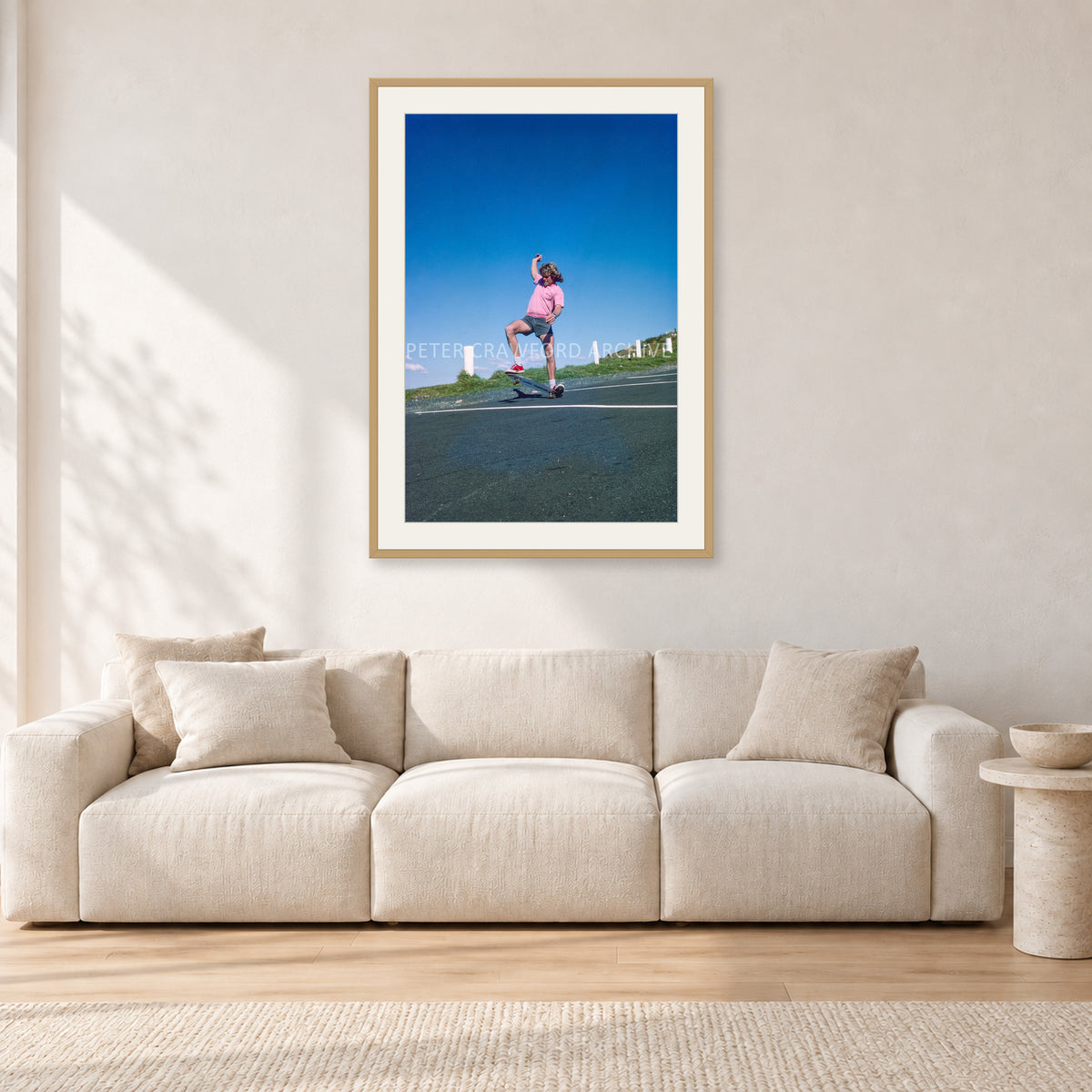 Col Smith DY 1977 by Peter Crawford — 60 × 90 cm, hayseed frame with white mat, shown in a light minimalist living room.