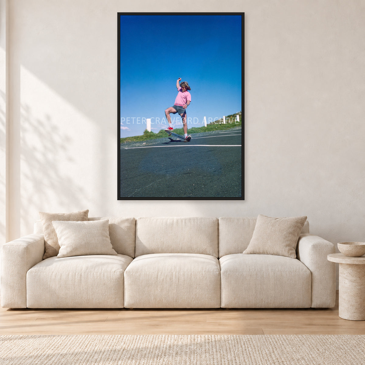Col Smith DY 1977 by Peter Crawford — 80 × 120 cm, black frame, shown in a light minimalist living room.