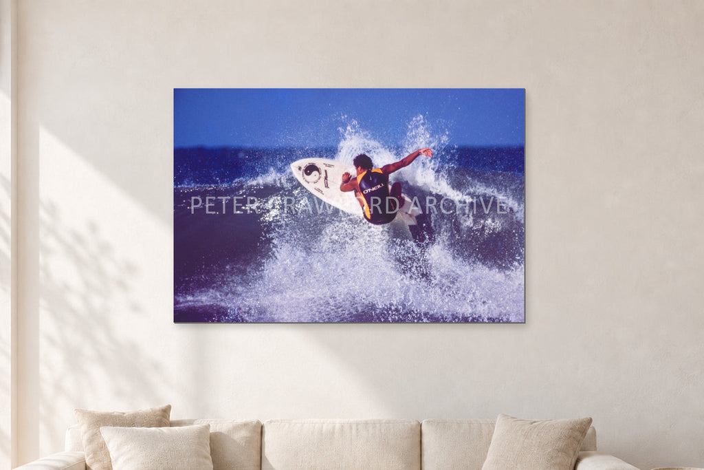 Dane Kealoha, Off The Wall 1977 by Peter Crawford — 120 × 80 cm, aluminium-mounted resin print, shown in a light minimalist living room.