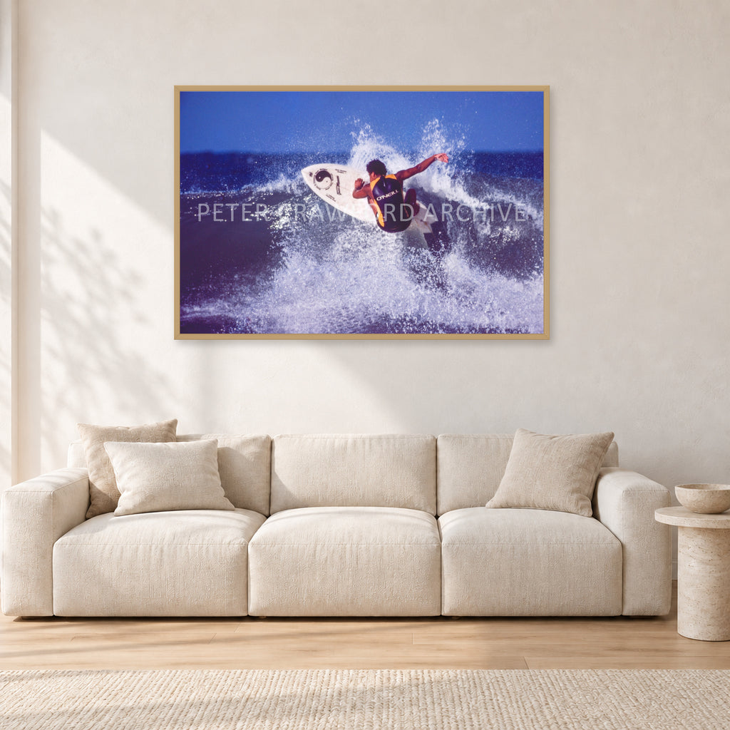 Dane Kealoha, Off The Wall 1977 by Peter Crawford — 120 × 80 cm, hayseed frame, shown in a light minimalist living room.