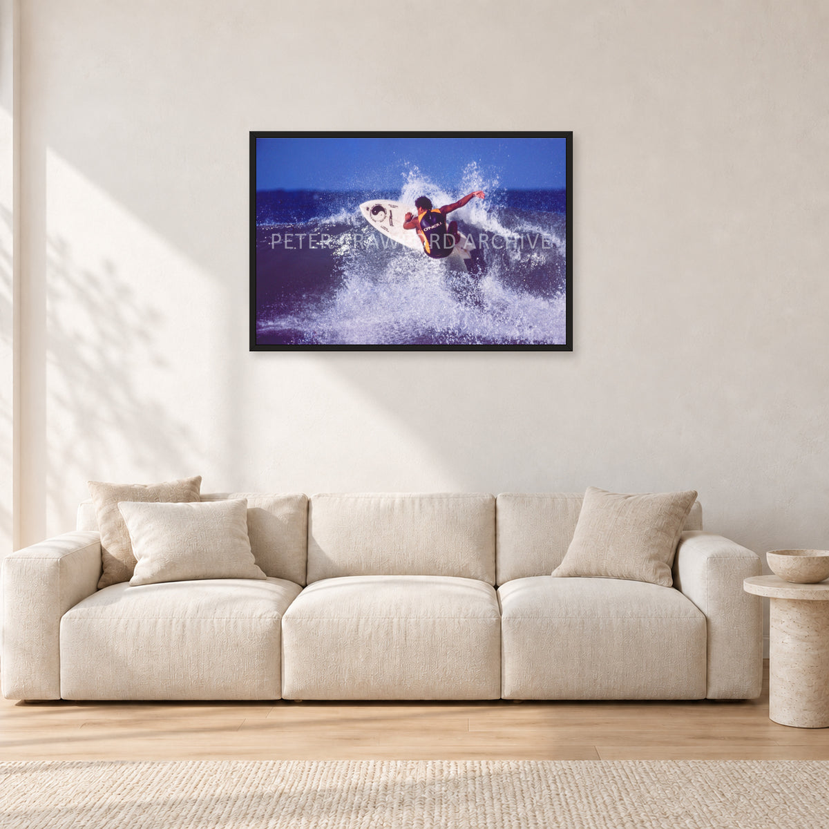 Dane Kealoha, Off The Wall 1977 by Peter Crawford — 90 × 60 cm, black frame, shown in a light minimalist living room.