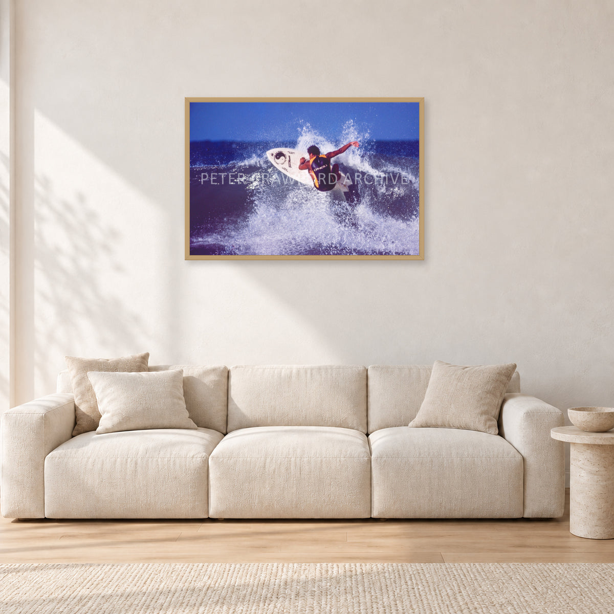 Dane Kealoha, Off The Wall 1977 by Peter Crawford — 90 × 60 cm, hayseed frame, shown in a light minimalist living room.