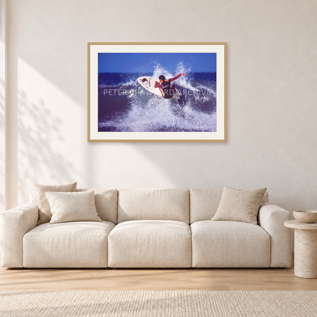 Dane Kealoha, Off The Wall 1977 by Peter Crawford — 90 × 60 cm, hayseed frame with white mat, shown in a light minimalist living room.
