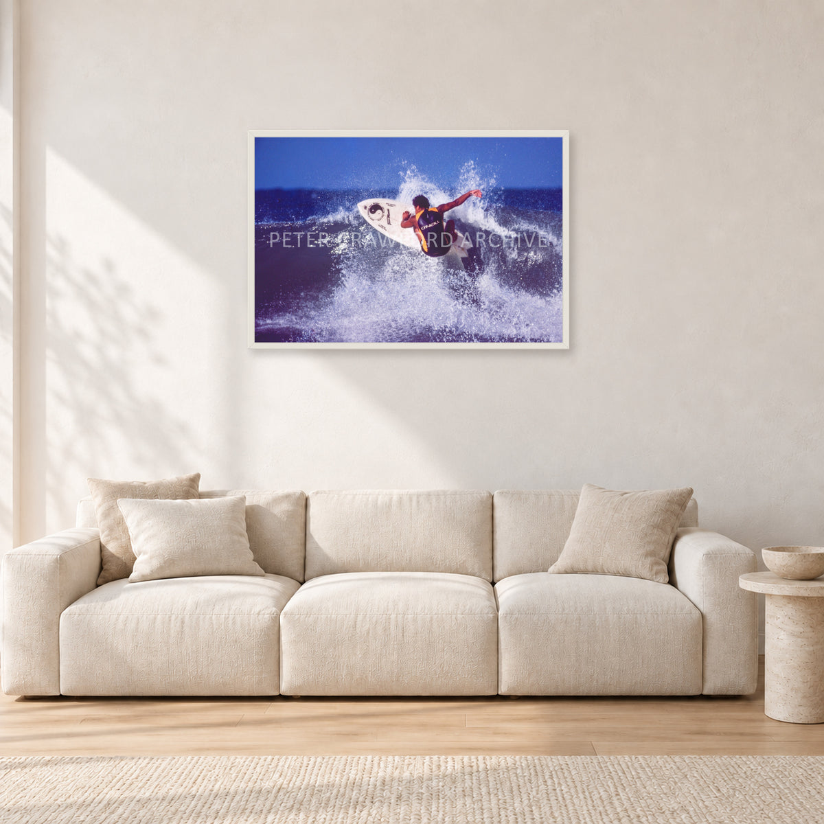 Dane Kealoha, Off The Wall 1977 by Peter Crawford — 90 × 60 cm, white frame, shown in a light minimalist living room.