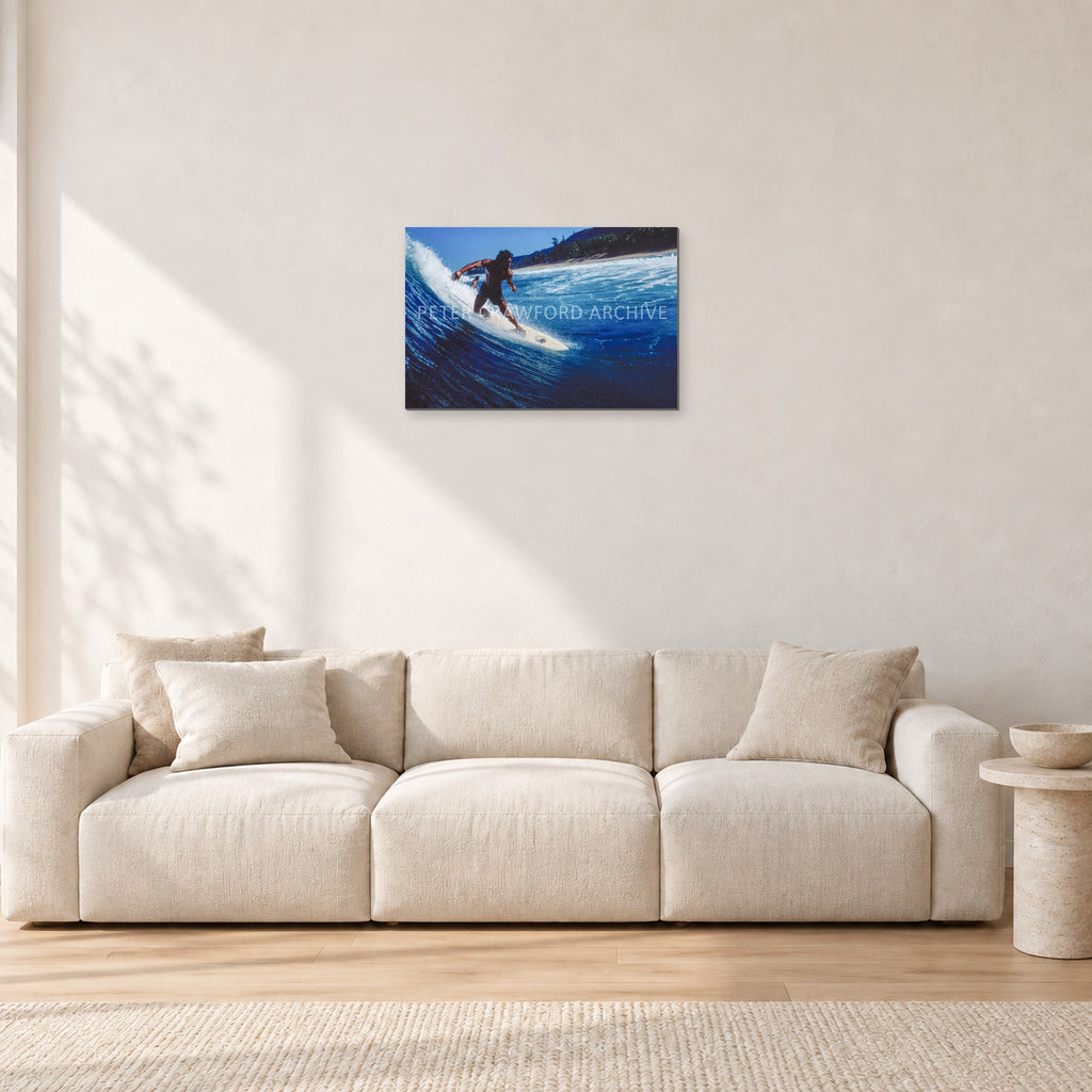 Dane Kealoha, Off The Wall 1978 by Peter Crawford — 60 × 40 cm, aluminium-mounted resin print, shown in a light minimalist living room.