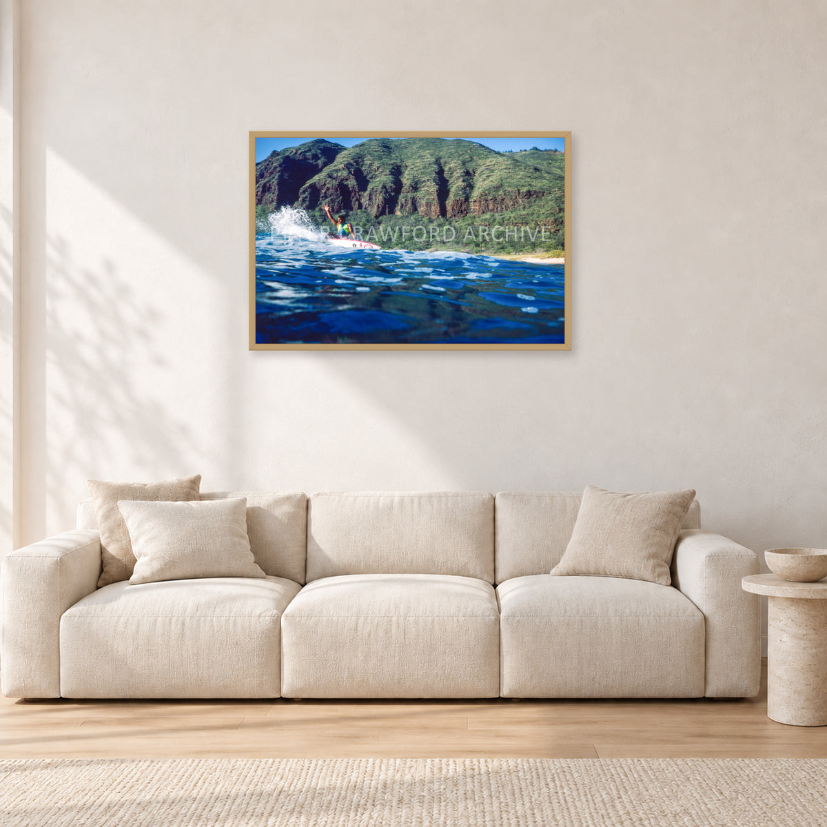Dane Kealoha, West Side Oahu by Peter Crawford — 90 × 60 cm, hayseed frame, shown in a light minimalist living room.