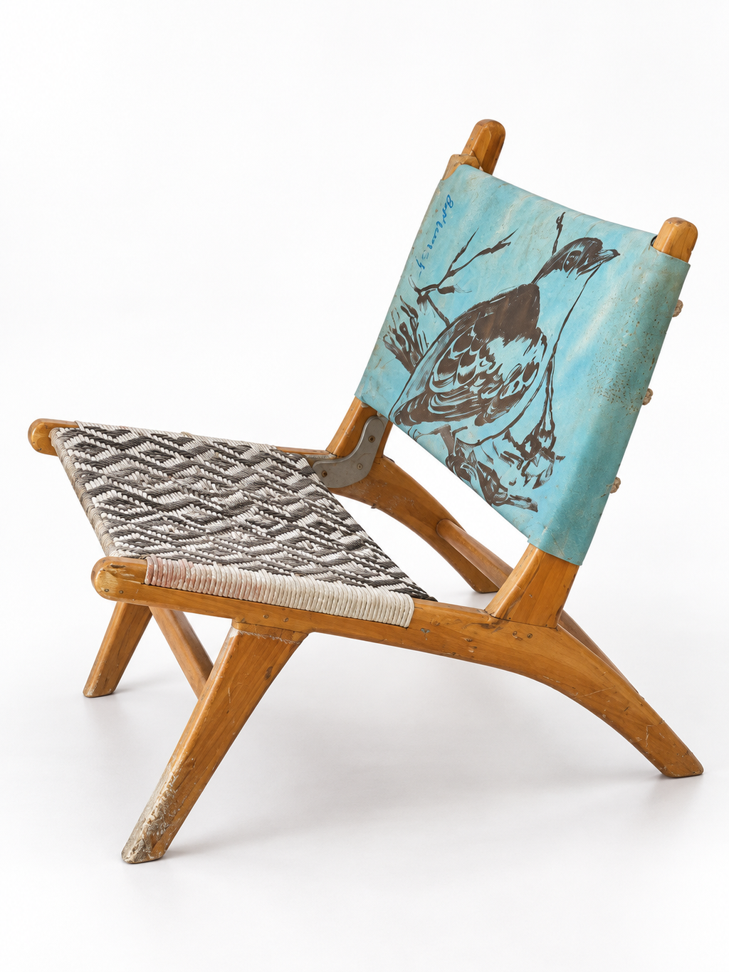 David Bromley Bird Chair 2 angled view showing the timber frame, bird artwork and geometric woven seat
