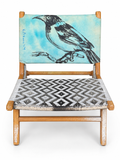David Bromley Bird Chair front view with turquoise bird artwork and a geometric woven seat