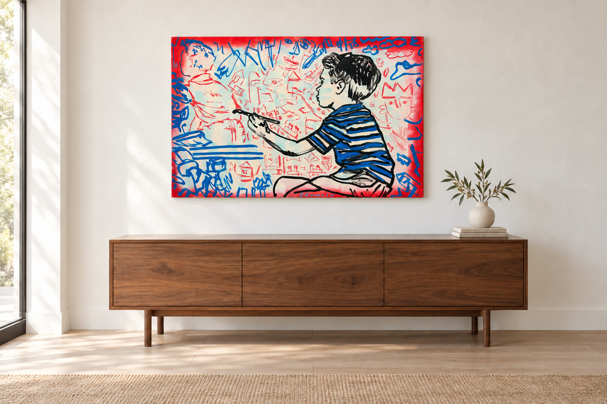 Room mockup of David Bromley Boy Painting Dreams, 120 × 80 cm, displayed above a walnut sideboard in a light neutral interior.