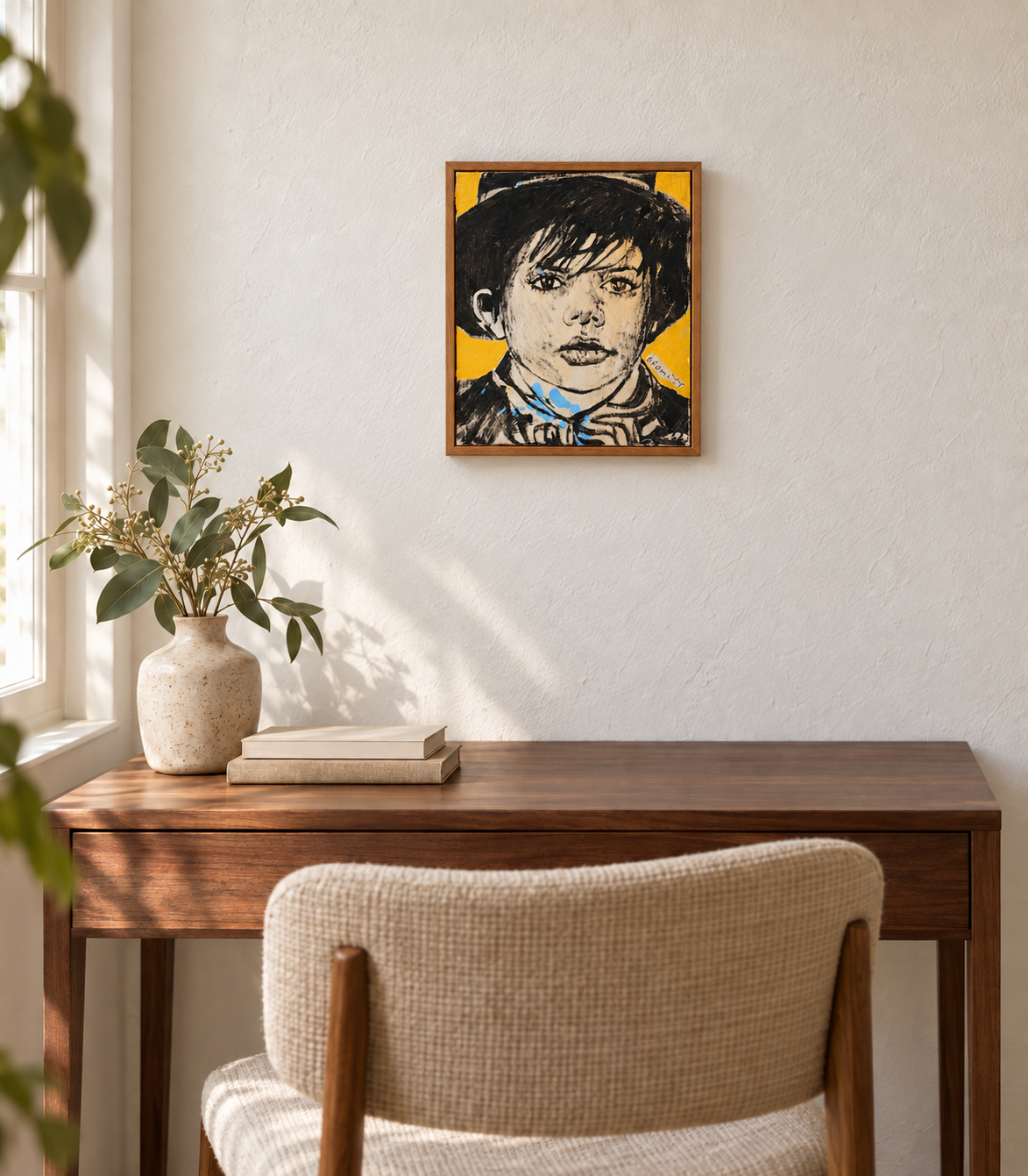 David Bromley Gold Boy, 41 × 47 cm, shown at a smaller scale above a walnut desk in a neutral room.