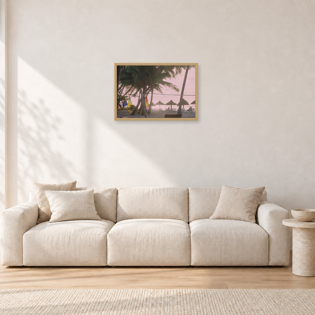 Fiji Sunset I by Peter Crawford — 60 × 40 cm, hayseed frame, shown in a light minimalist living room.