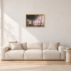 Fiji Sunset I by Peter Crawford — 60 × 40 cm, hayseed frame, shown in a light minimalist living room.