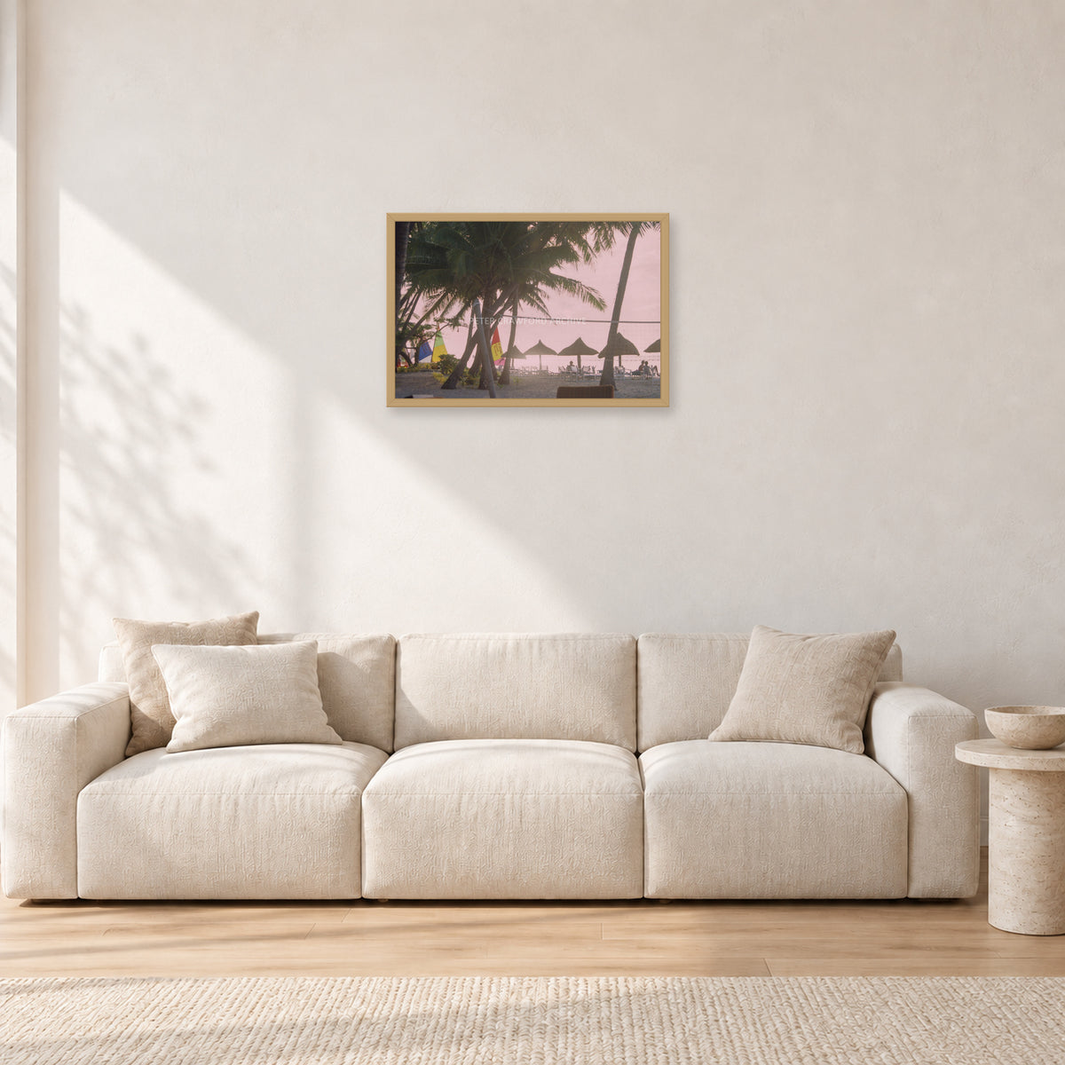 Fiji Sunset I by Peter Crawford — 60 × 40 cm, hayseed frame, shown in a light minimalist living room.