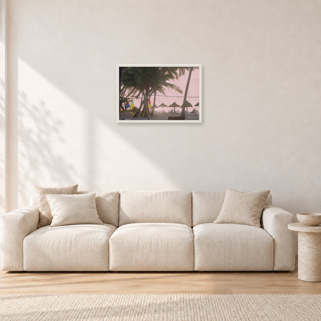 Fiji Sunset I by Peter Crawford — 60 × 40 cm, white frame, shown in a light minimalist living room.