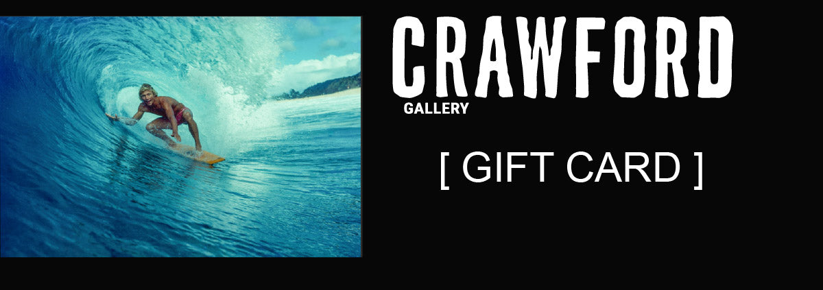 Crawford Gallery gift card design with a surfer inside a blue wave and white gallery lettering on black.