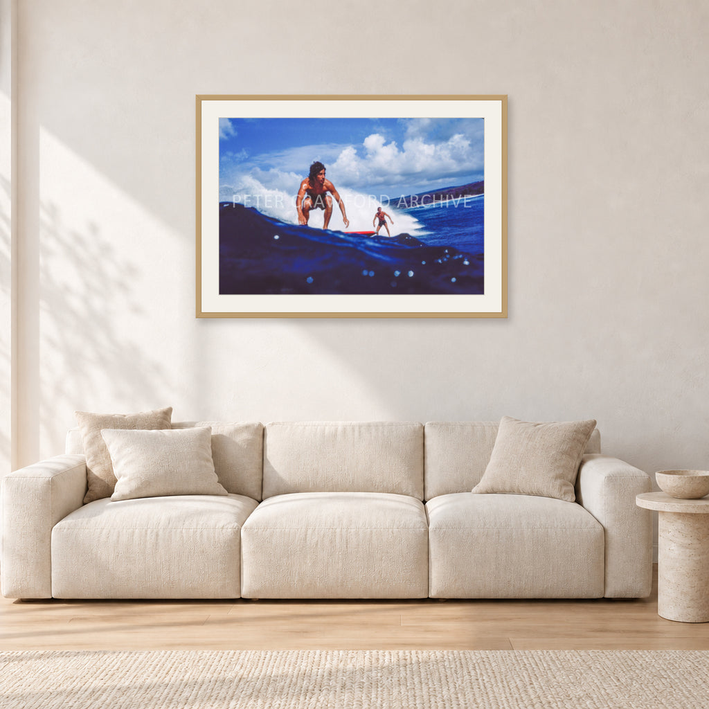 Hawaii Surf Study 24 by Peter Crawford — 90 × 60 cm, hayseed frame with white mat, shown in a light minimalist living room.