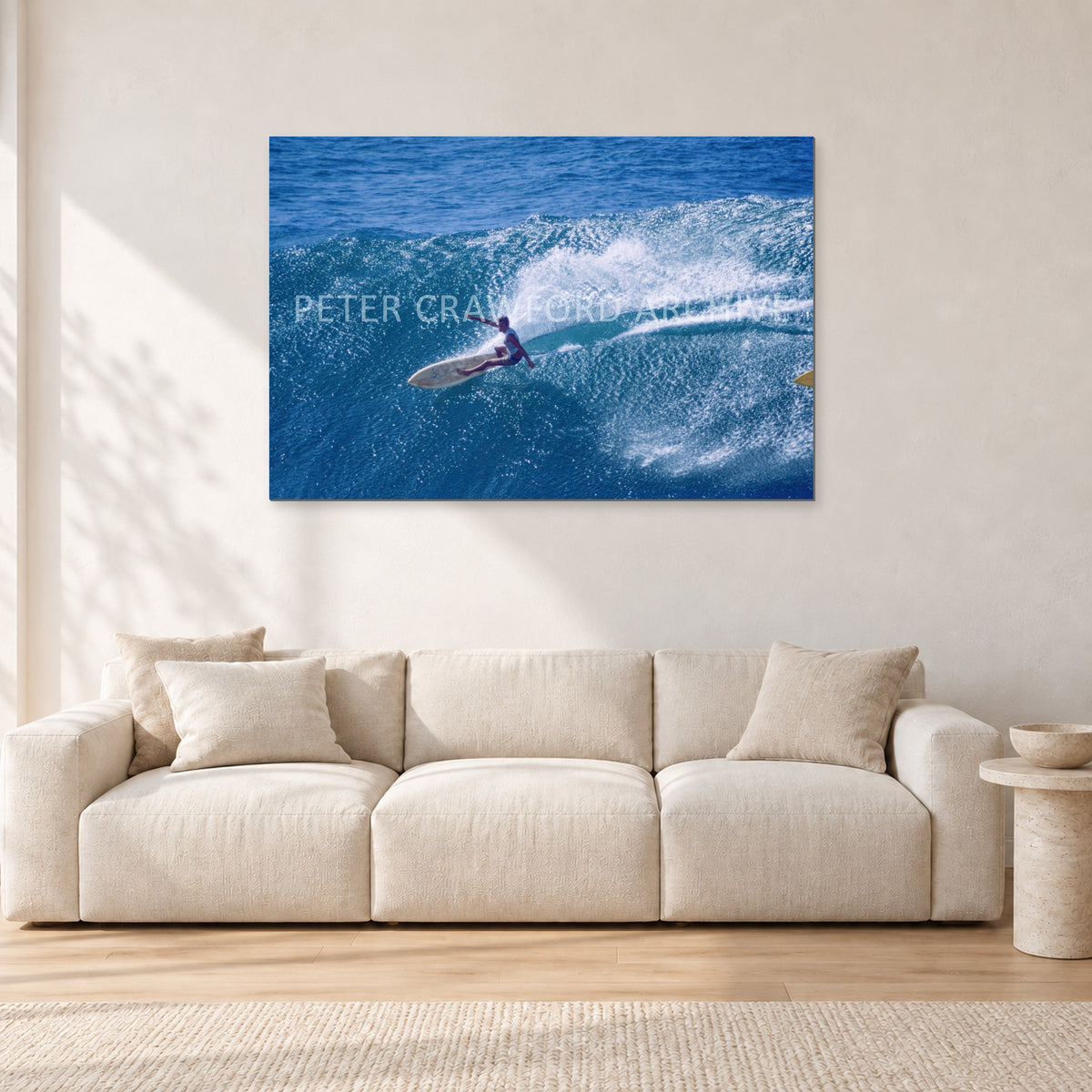 Honolua Bay, No Leash by Peter Crawford — 120 × 80 cm, aluminium-mounted resin print, shown in a light minimalist living room.