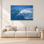 Honolua Bay, No Leash by Peter Crawford — 120 × 80 cm, hayseed frame, shown in a light minimalist living room.