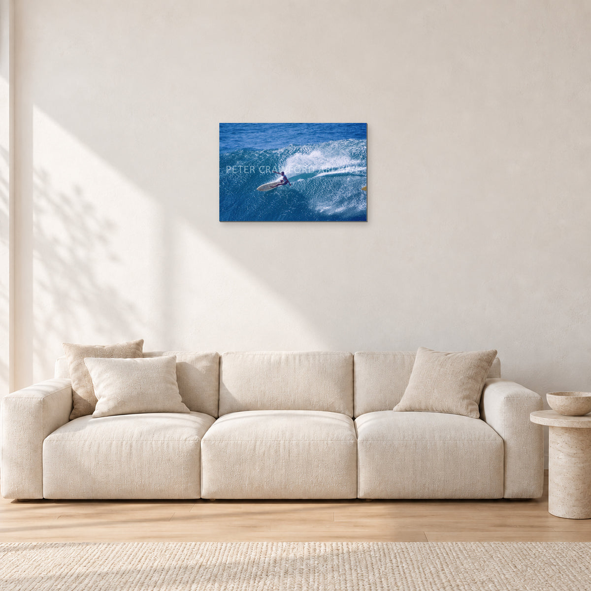 Honolua Bay, No Leash by Peter Crawford — 60 × 40 cm, aluminium-mounted resin print, shown in a light minimalist living room.