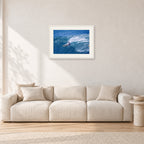 Honolua Bay, No Leash by Peter Crawford — 60 × 40 cm, white frame with white mat, shown in a light minimalist living room.