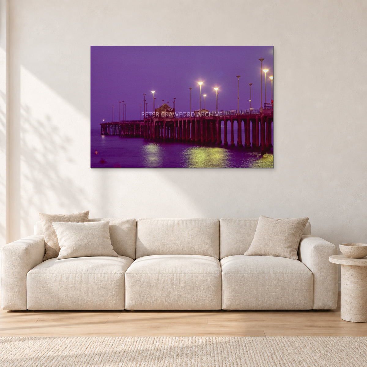 Huntington Pier by Peter Crawford — 120 × 80 cm, aluminium-mounted resin print, shown in a light minimalist living room.