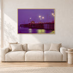 Huntington Pier by Peter Crawford — 120 × 80 cm, hayseed frame, shown in a light minimalist living room.