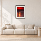 Indonesian Sunset Kids by Peter Crawford — 40 × 60 cm, black frame with white mat, shown in a light minimalist living room.