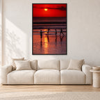 Indonesian Sunset Kids by Peter Crawford — 80 × 120 cm, black frame, shown in a light minimalist living room.