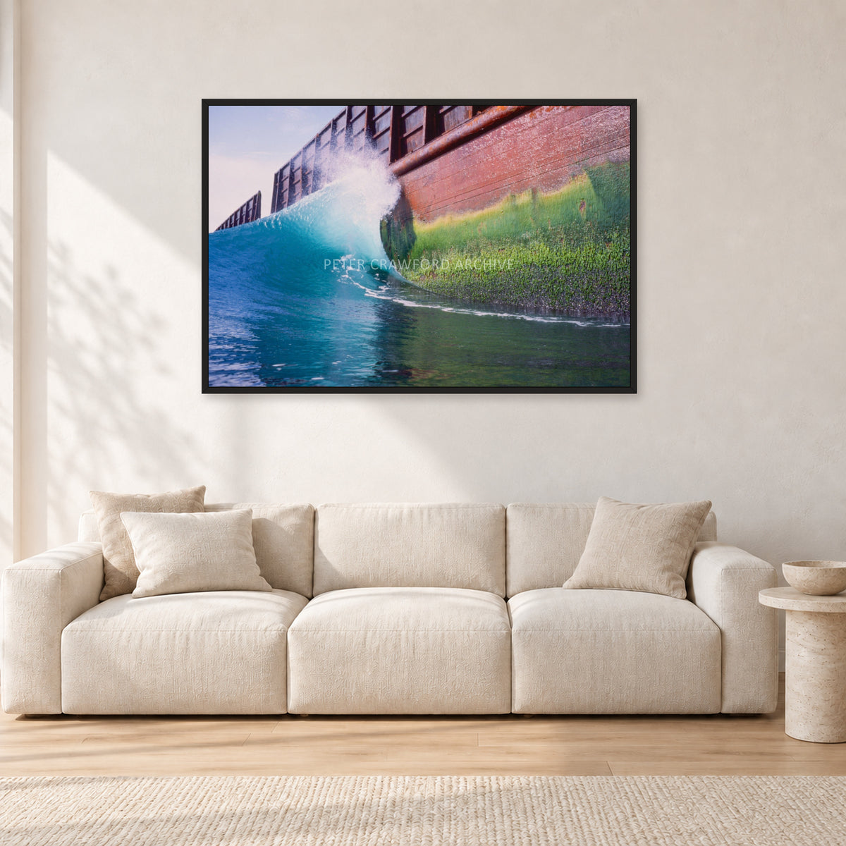 Indonesian Wreck, 1999 by Peter Crawford — 120 × 80 cm, black frame, shown in a light minimalist living room.