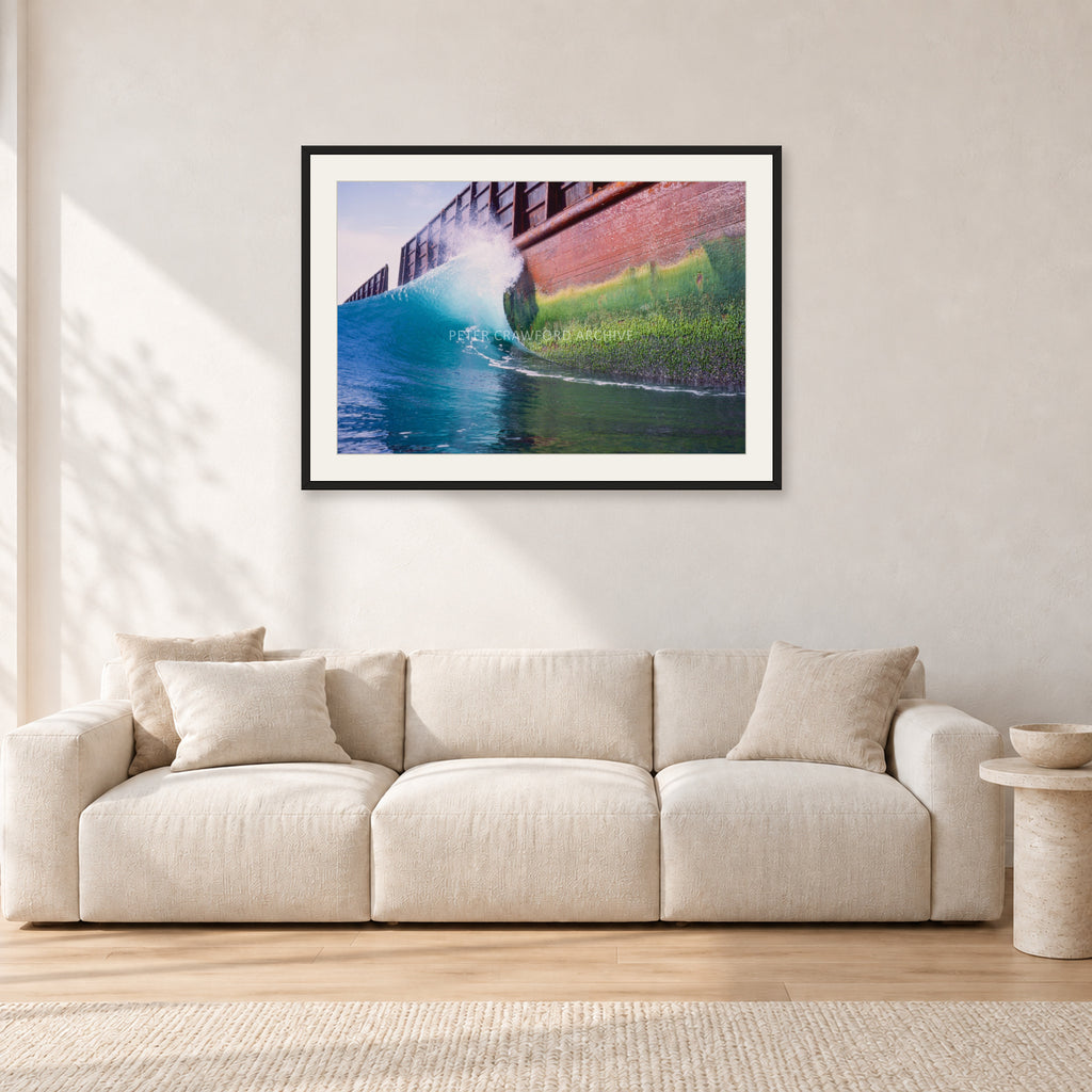 Indonesian Wreck, 1999 by Peter Crawford — 90 × 60 cm, black frame with white mat, shown in a light minimalist living room.