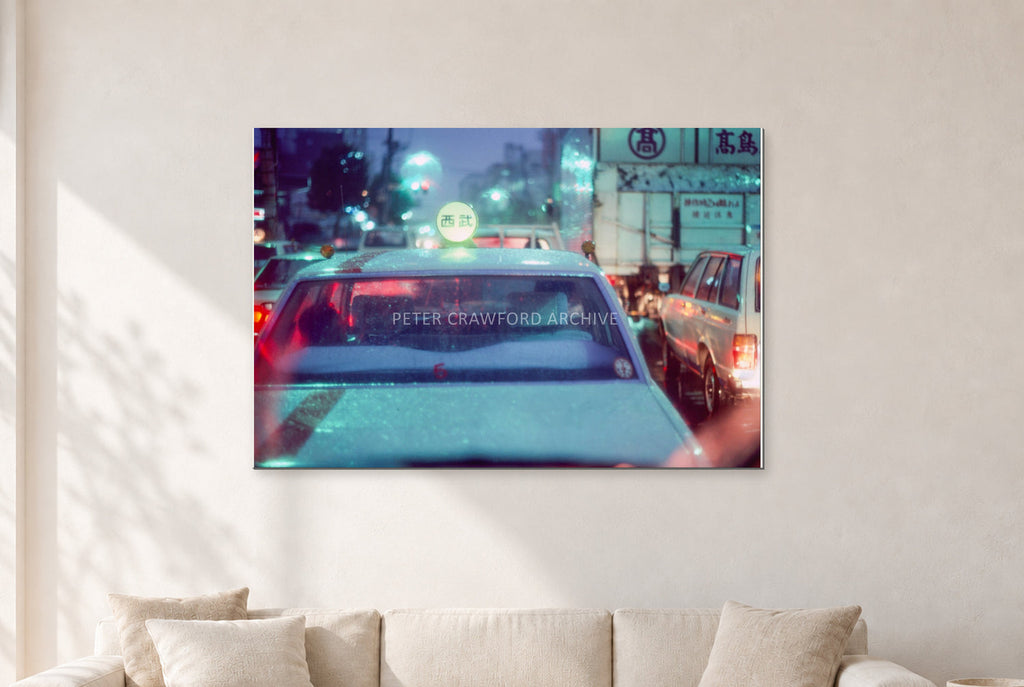 Japan City Lights by Peter Crawford — 120 × 80 cm, aluminium-mounted resin print, shown in a light minimalist living room.