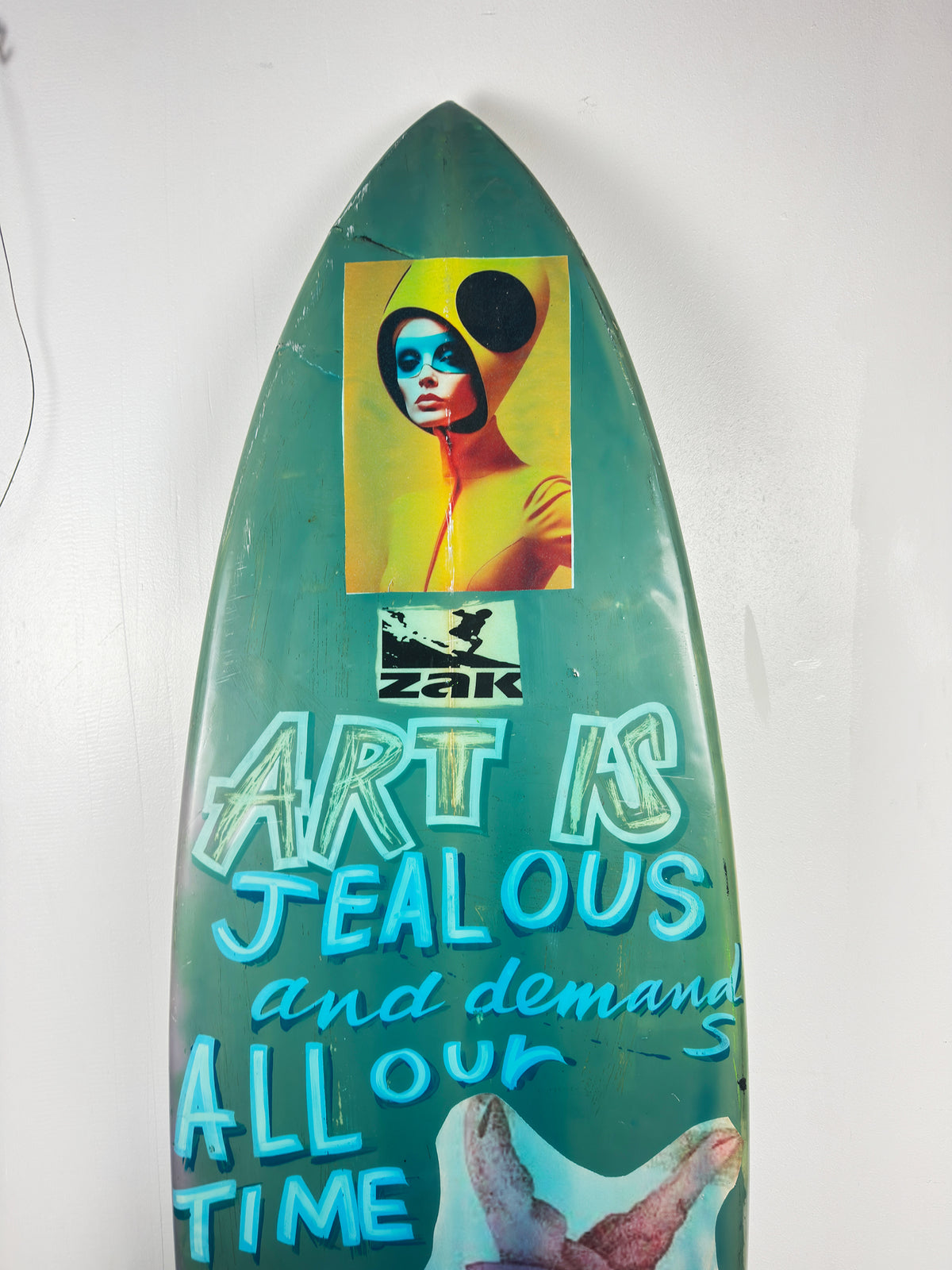 Blue Skulls Surfboard by David Bromley — upper turquoise portrait detail.