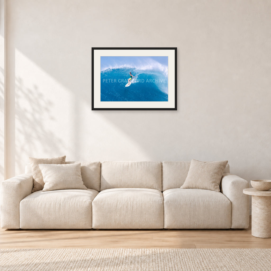 Kong, Sunset Beach 1980s by Peter Crawford — 60 × 40 cm, black frame with white mat, shown in a light minimalist living room.