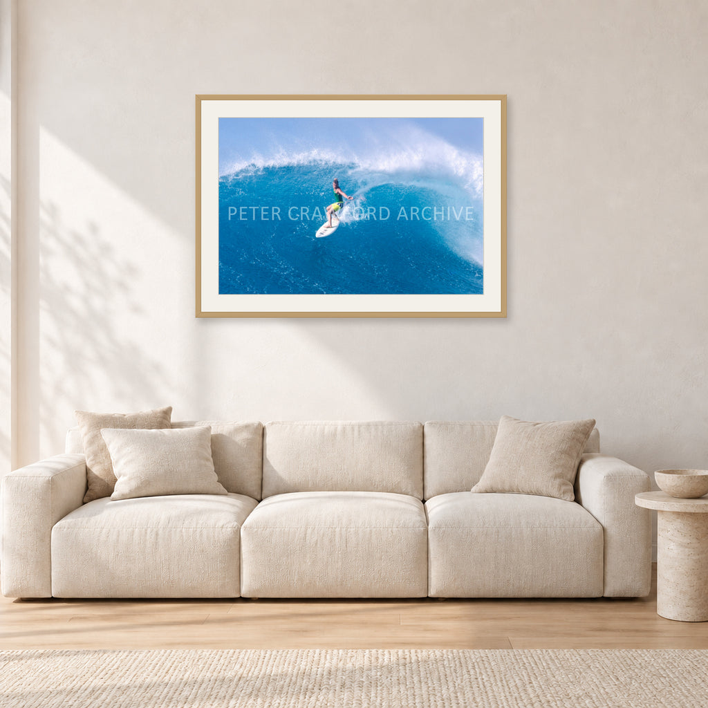 Kong, Sunset Beach 1980s by Peter Crawford — 90 × 60 cm, hayseed frame with white mat, shown in a light minimalist living room.