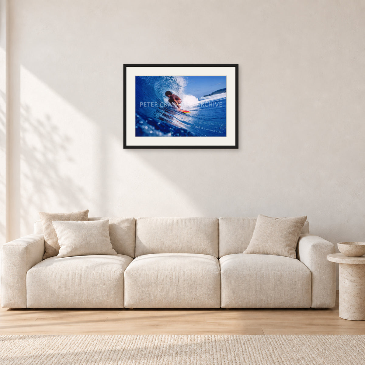 Larry Bertlemann, Off The Wall by Peter Crawford — 60 × 40 cm, black frame with white mat, shown in a light minimalist living room.