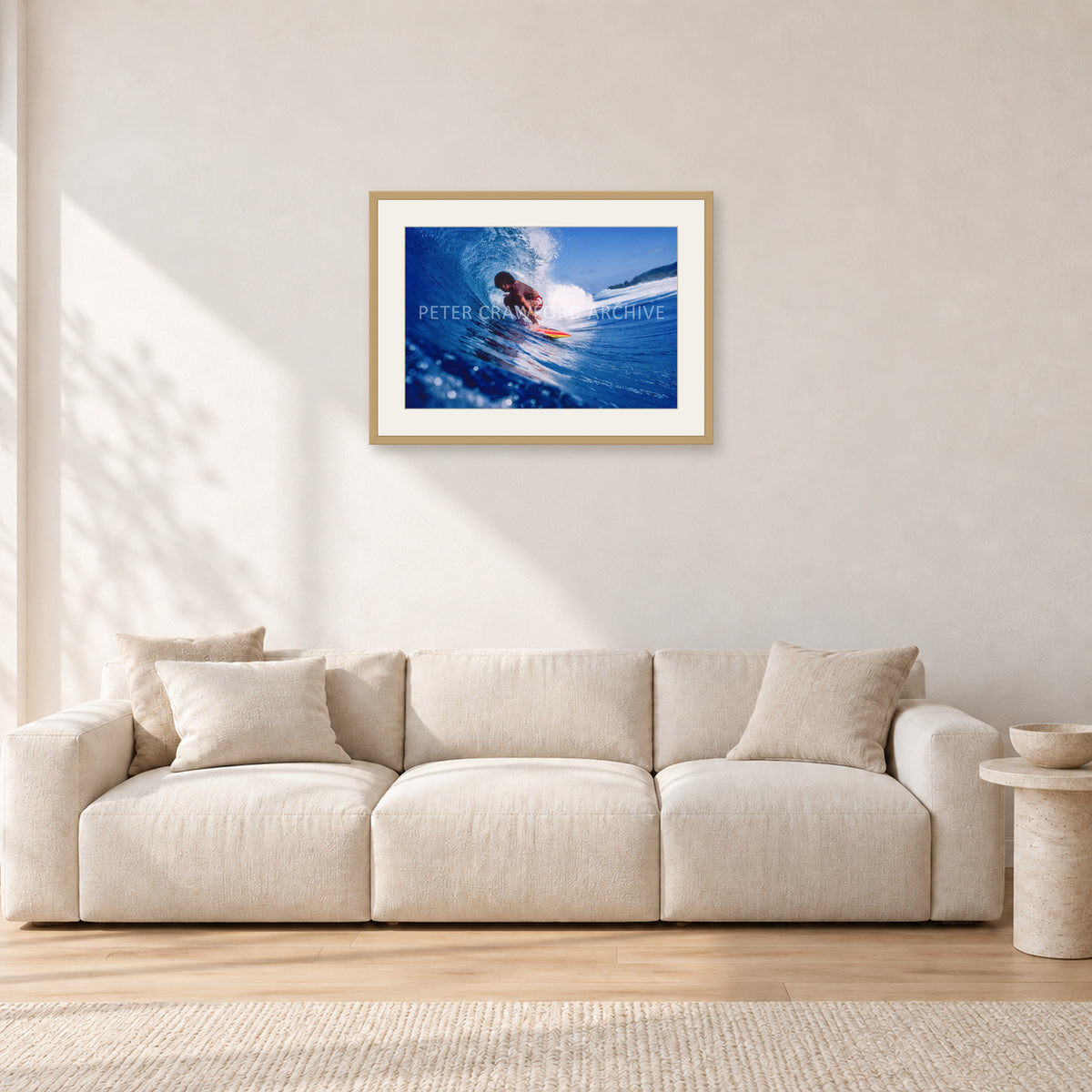 Larry Bertlemann, Off The Wall by Peter Crawford — 60 × 40 cm, hayseed frame with white mat, shown in a light minimalist living room.